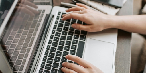 freelancer using laptop at table at home, author: Vlada Karpovich